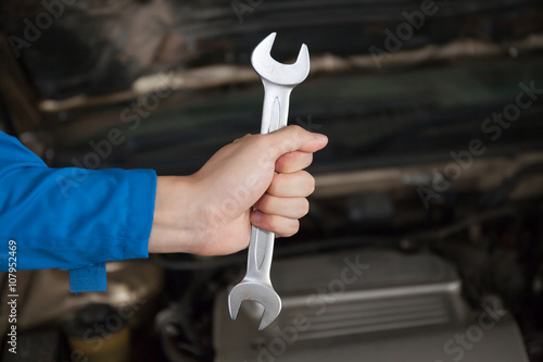 Wallpaper Mural Man in blue technician uniform going to repair for car maintenance Torontodigital.ca