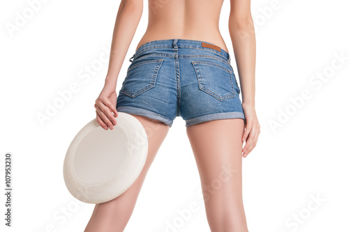 young happy woman playing frisbee over white