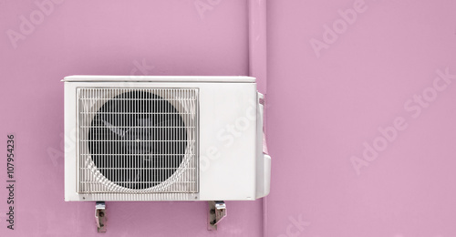 air compressor on pink wall