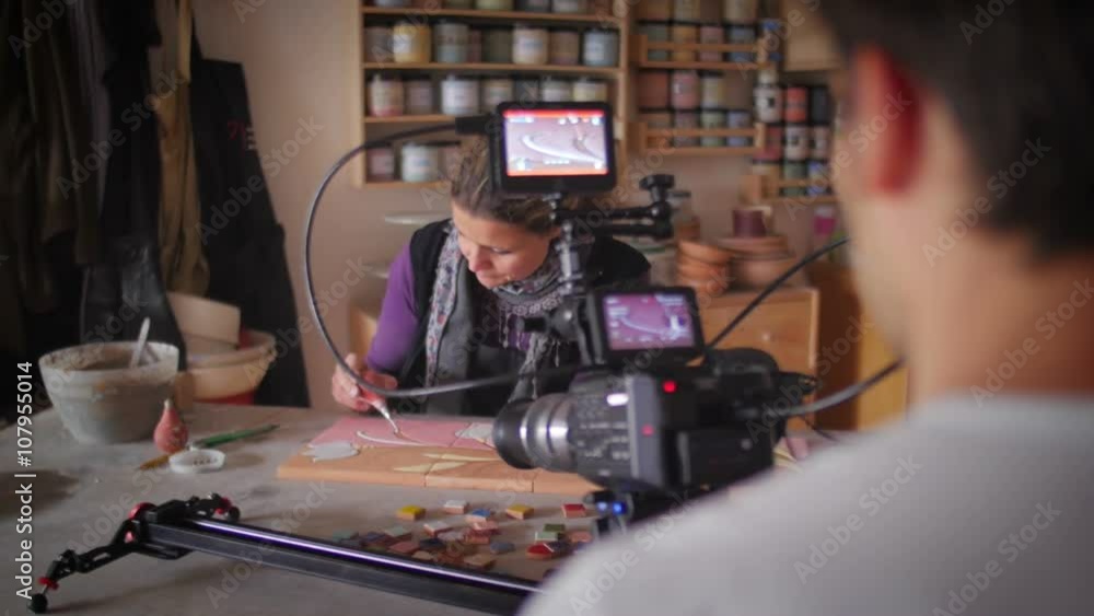 Slow motion of ceramic maker working in front of a video-maker Slow motion of ceramic maker working in front of a video-maker