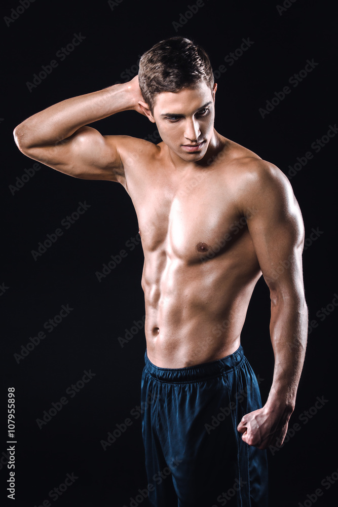 Fitness boy on black background Fitness boy on black background