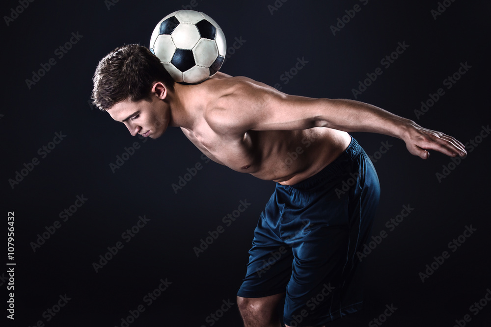Football player on black background Football player on black background