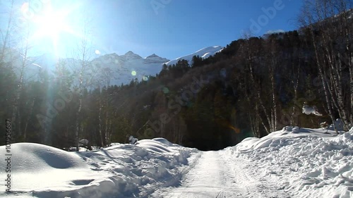Mountain landscape on a sunny winter day, ski, snow and forest
