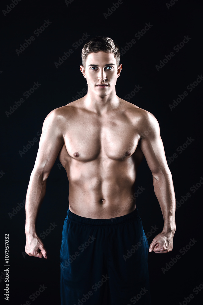 Fitness boy on black background Fitness boy on black background