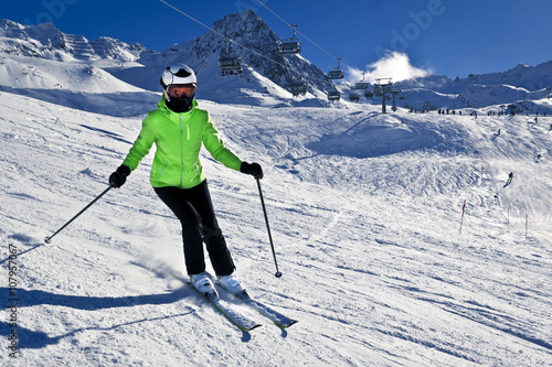 young woman is enjoying winter sports in Austrian Alps