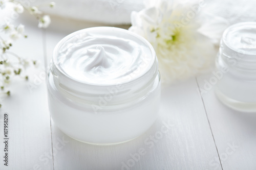 Fotografija Anti wrinkle cosmetic cream with herbal flowers face, skin and body care hygiene