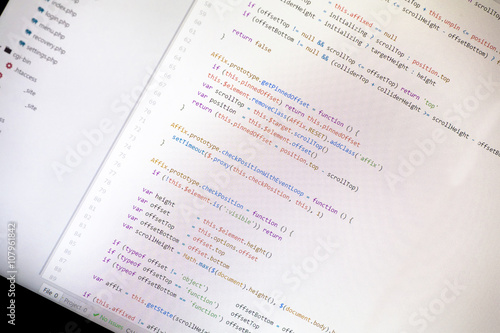 Colorful programming php and html code on a monitor.