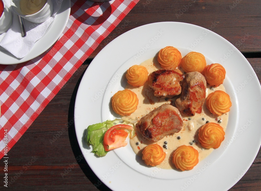 Lunch in the garden, escalopes with fried potato puree rosettes