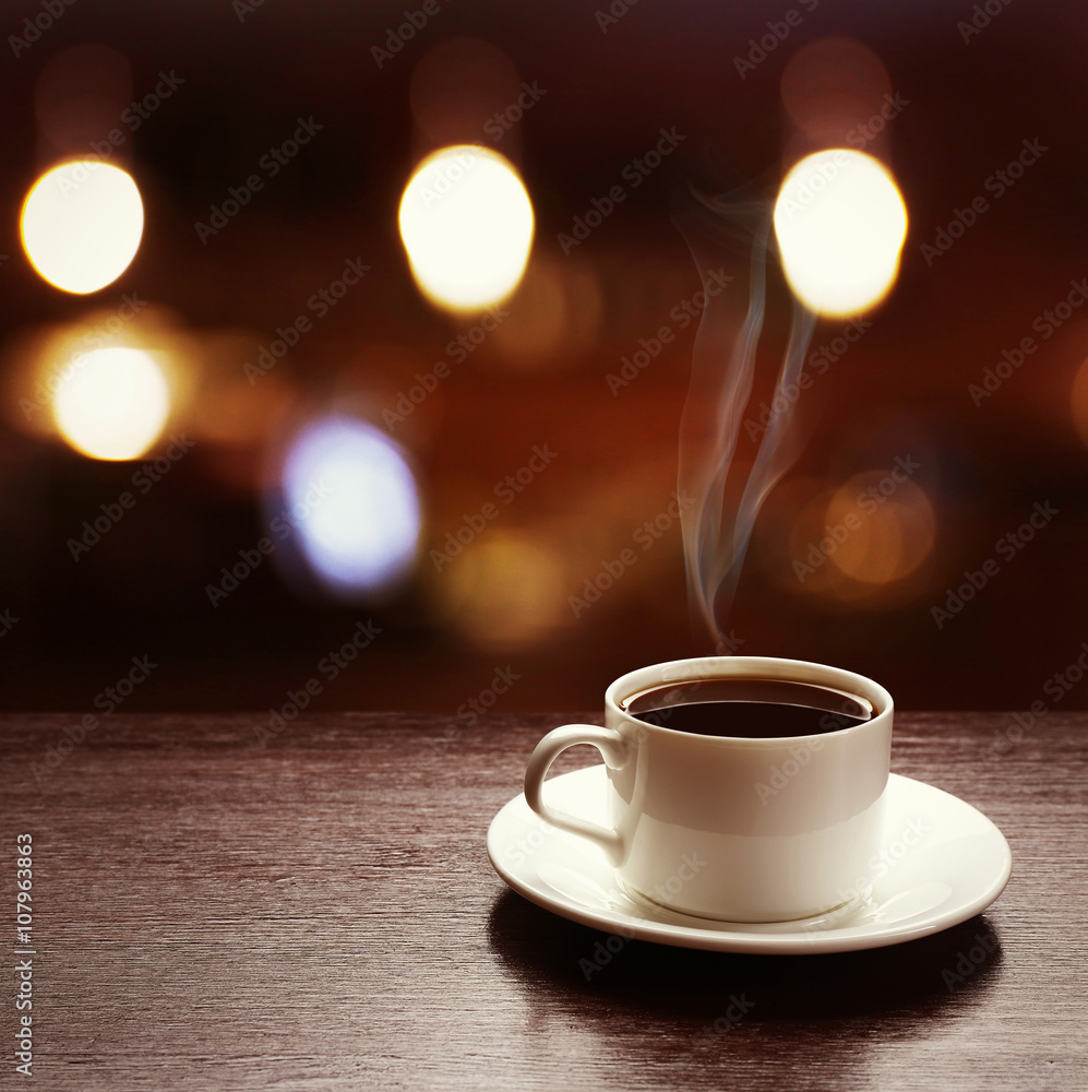 Cup of coffee on table on blured cafe background Cup of coffee on table on blured cafe background