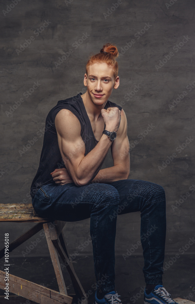 A man in a jeans and black t shirt. A man in a jeans and black t shirt.
