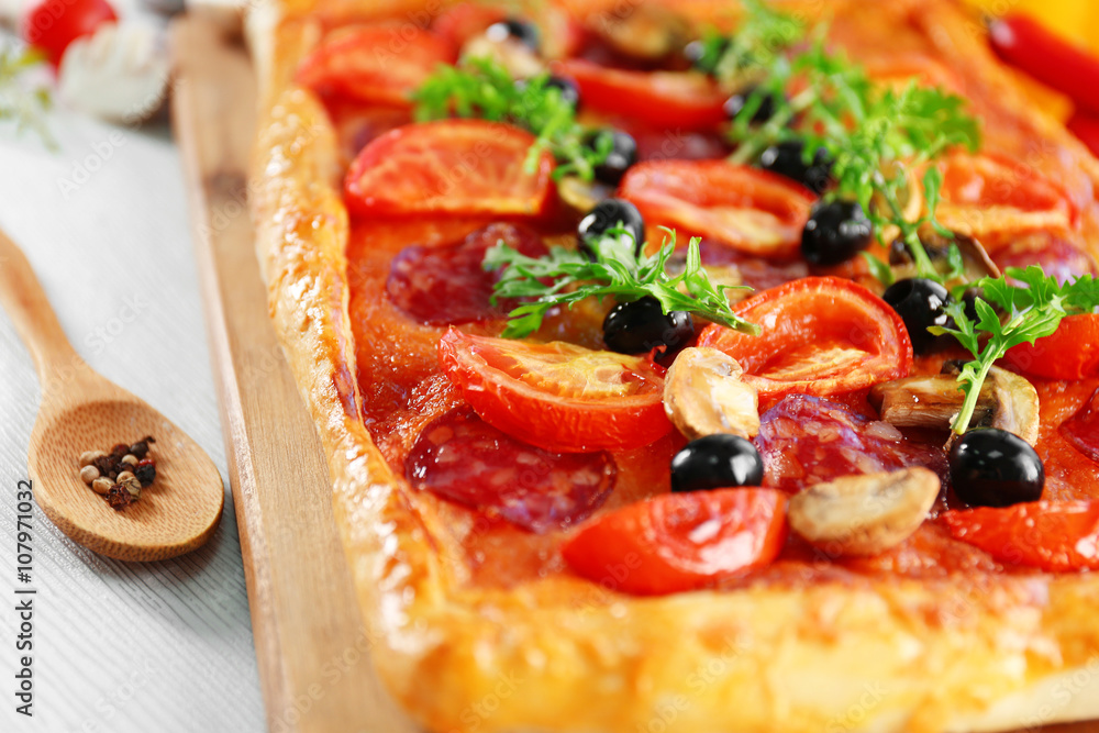 Rectangle delicious pizza on the table, close-up Rectangle delicious pizza on the table, close-up