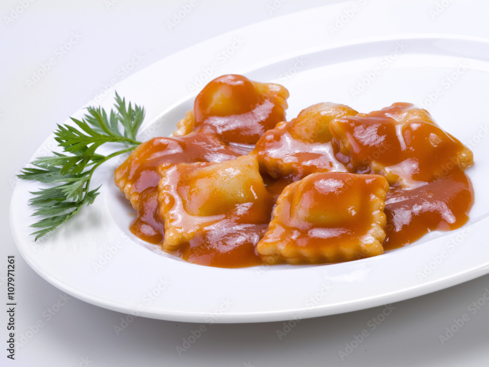 Plate ravioli with tomato sauce Plate ravioli with tomato sauce
