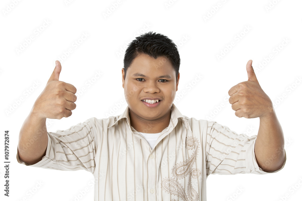 portrait of a boy showing thumbs up. portrait of a boy showing thumbs up.