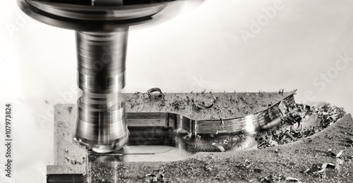 Milling cutter work with splinters flying off, monochrome versio photo