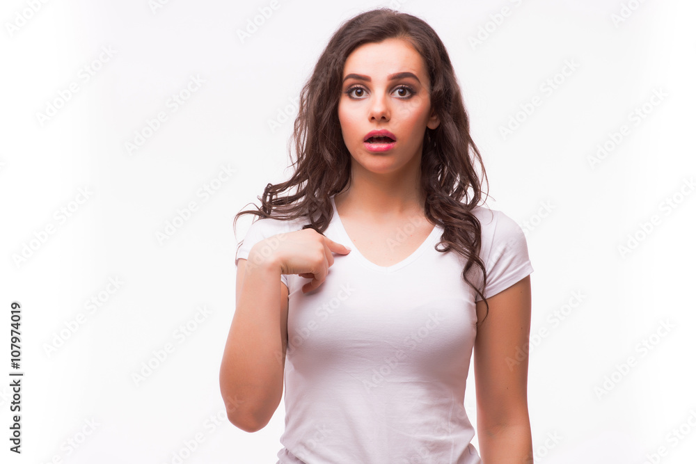 young woman in blank white t-shirt missunderstand pointing finger on herself young woman in blank white t-shirt missunderstand pointing finger on herself