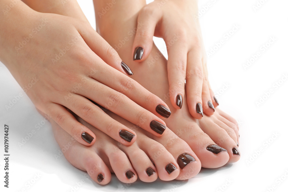 Manicured female feet and hands isolated on white Manicured female feet and hands isolated on white