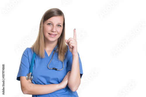Female doctor pointing up one finger