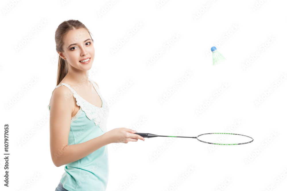 beautiful girl playing with badminton racket 