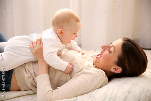 Beautiful woman and cute ba...