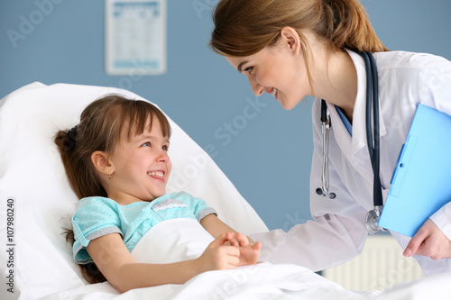 Doctor and little girl in the office photo