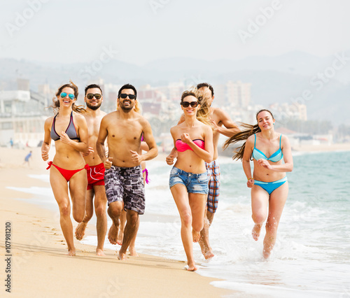 People running at beach © JackF