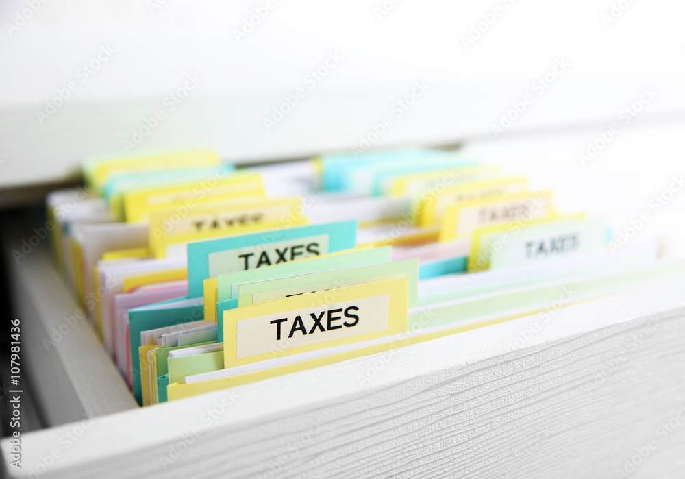 Wunschmotiv: Open drawer with variety of tax documents #107981436