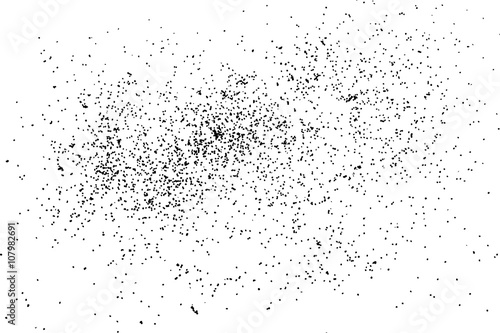 Grainy grunge abstract texture on white background. Random spread of black sparkles. Black glitter blow explosion on white background. Randomly sprayed twinkles and drops.