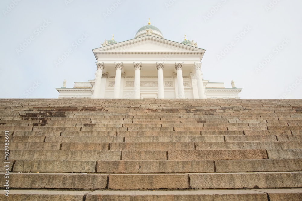 HELSINKI, FINLAND - april, 4, 2016: St. Nicholas Church and a monument of Alexander II on the Senatorial area in Helsinki, Finland.