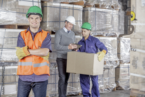 Workers In Warehouse Preparing Goods For shipping © Dan Kosmayer