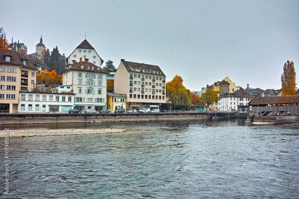 City of Luzern and reflection of old town in The Reuss River, Switzerland