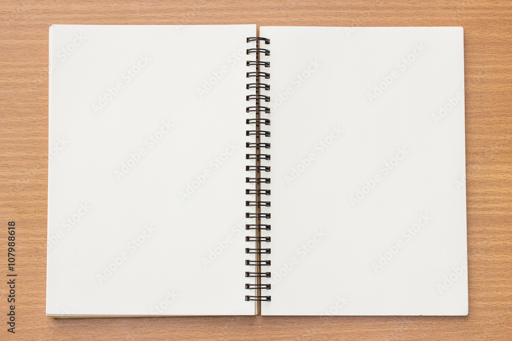 open book on textured wood background. open book on textured wood background.