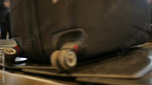 Airport baggage claim with luggage spinning around conveyor 