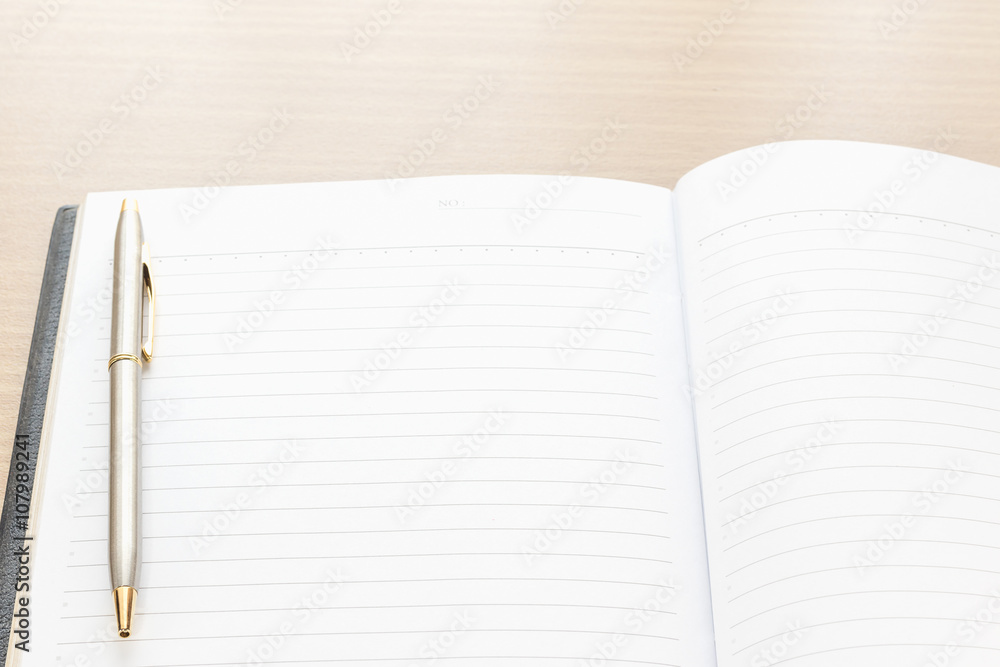 Pen put on notebook open blank page Pen put on notebook open blank page