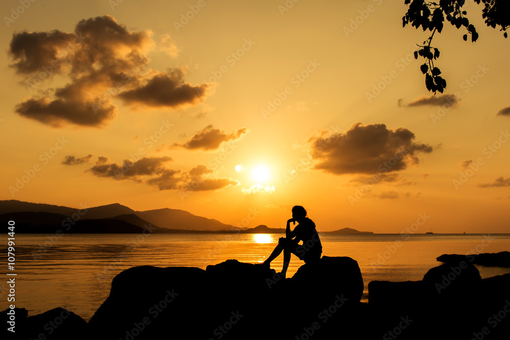 beautiful women sitting on the beach sunset background Stock Photo ...
