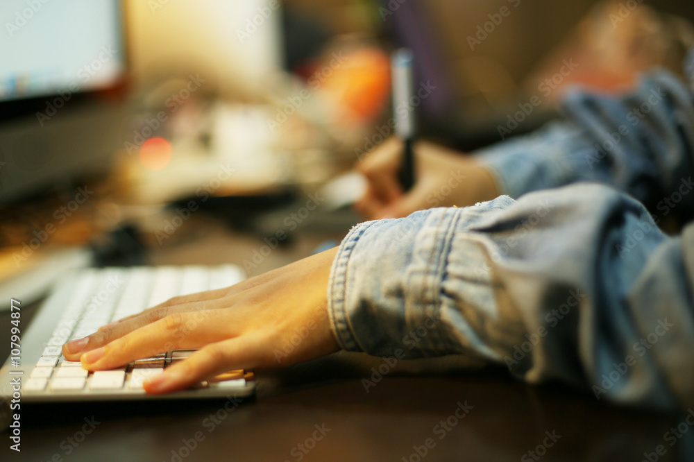 Designer using Intuos pro for work with computer and key board Designer using Intuos pro for work with computer and key board