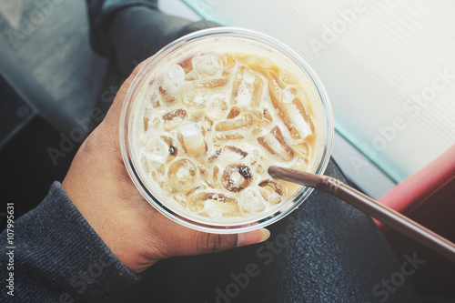 Selfie of hand with iced coffee