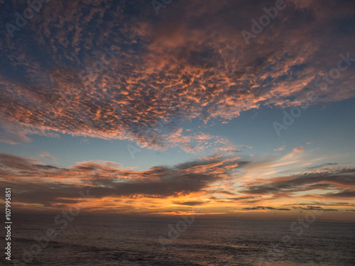 Sunset over the Atlantic Ocean composing a dramatic orange cloud © sotavento1000