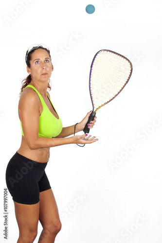 Woman playing Racquetball, shot on white background photo