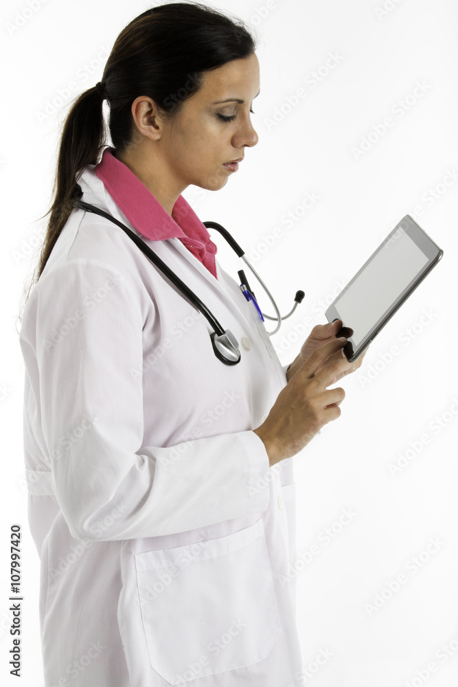 Female doctor with stethoscope using a computer tablet Female doctor with stethoscope using a computer tablet
