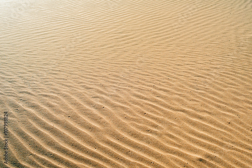 Background waves of sand of orange color