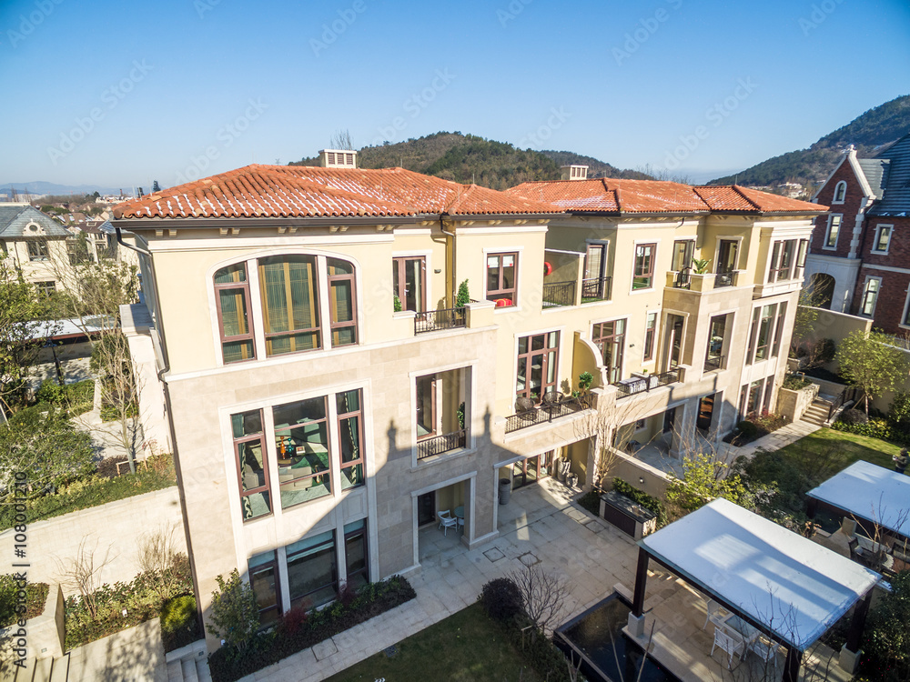 aerial view of houses of modern villa in sunny day