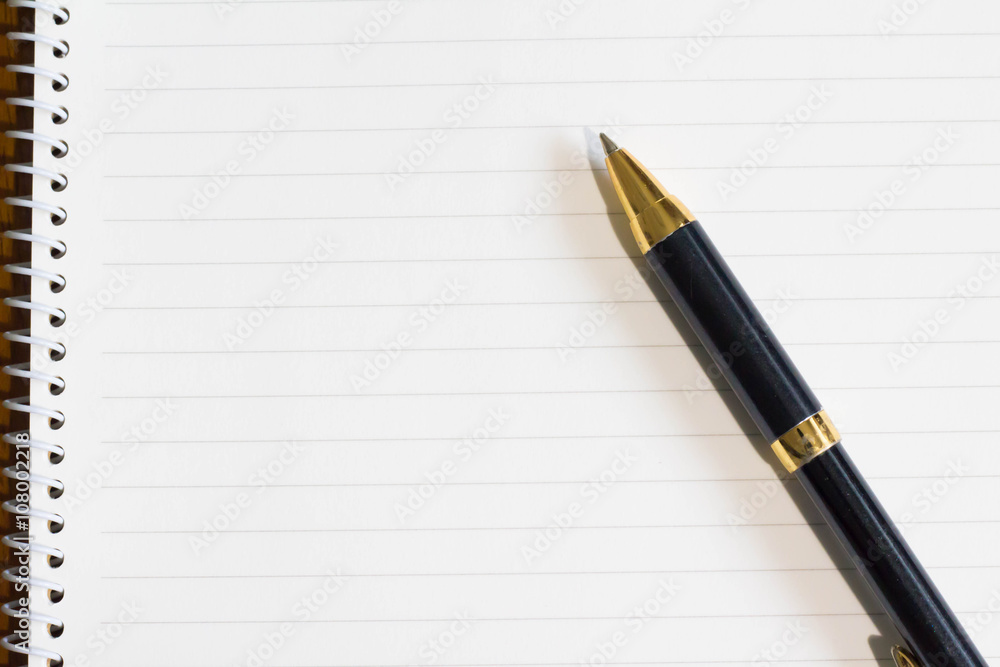 White notebook and pen White notebook and pen