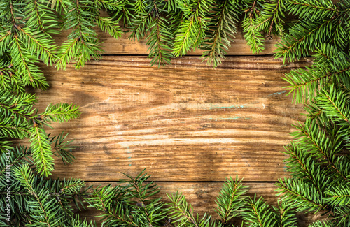 Green christmas tree frame on wooden boards