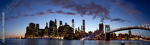 Panoramic of lower Manhattan in New York City showing the new World Trade Center Freedom Tower just after sunset     Summer 2014    5 pictures were used to make this large panoramic image  