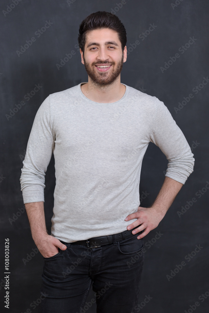 Cheerful young man with copy space and looking at camera with sm Cheerful young man with copy space and looking at camera with sm