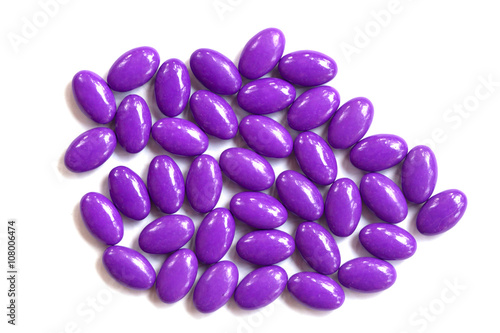 purple pills on white background isolated