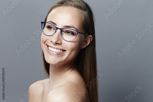 Young beautiful woman wearing blue framed glasses