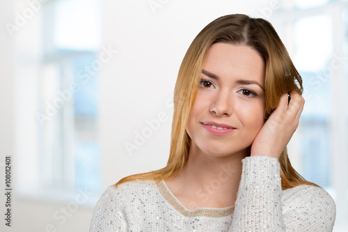 Portrait of happy smiling young beautiful woman