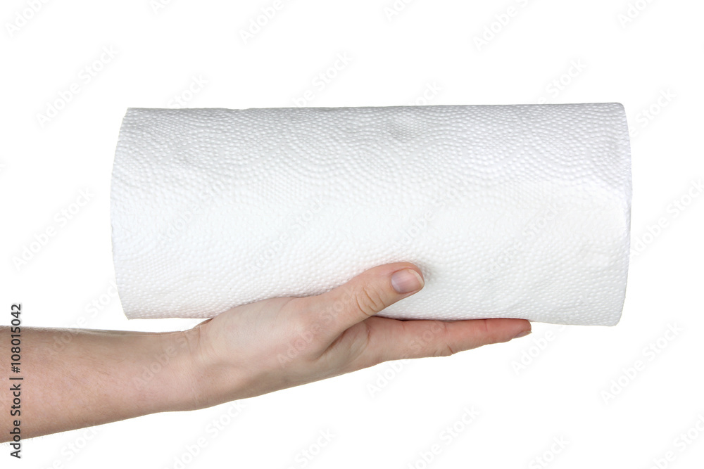 Fototapeta premium female hand holding a large roll of napkins isolated on white background