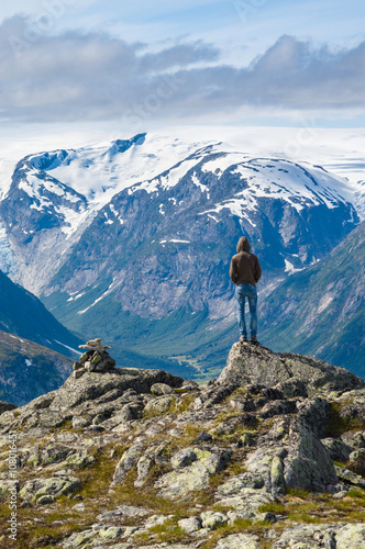Man on top of mountain in Norway © alexpolo